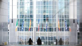 European flags in front of glazed building